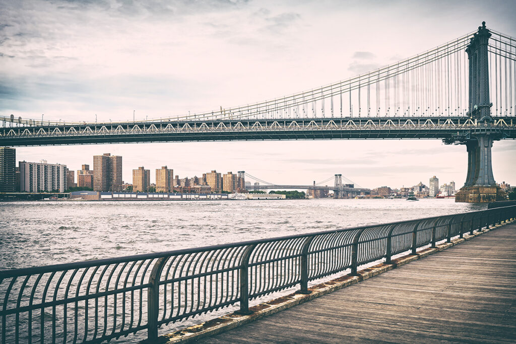 A scenic bridge and a beautiful Manhattan skyline