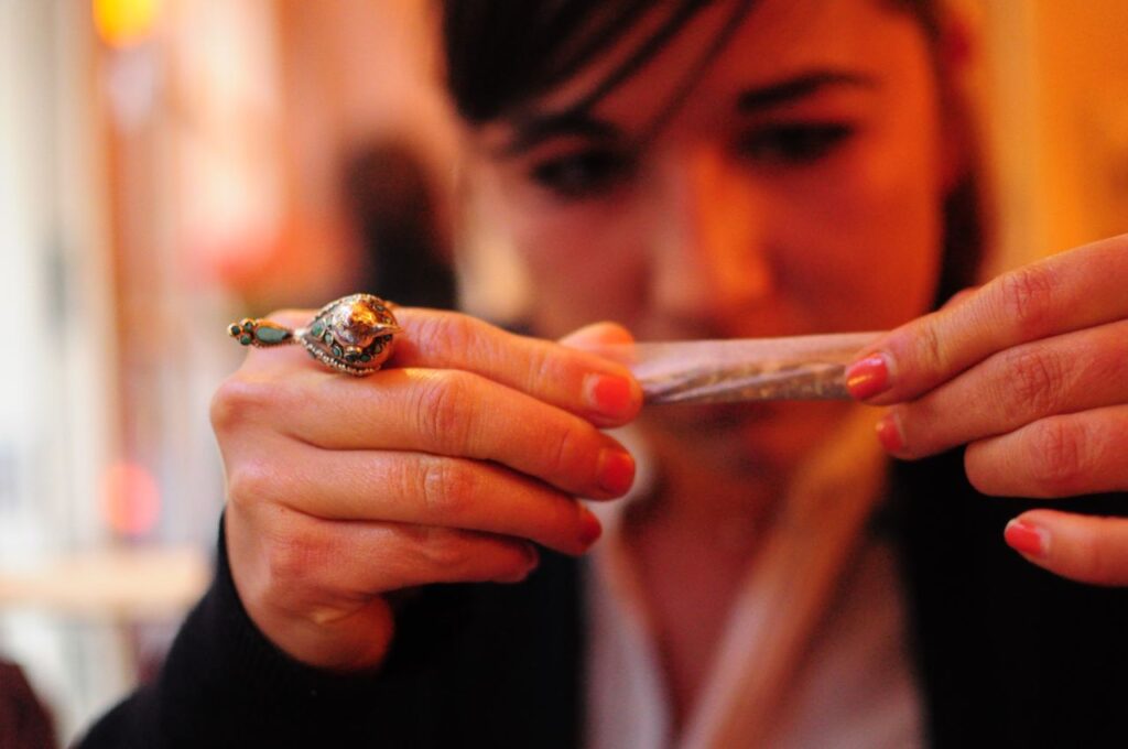 A women rolling a joint