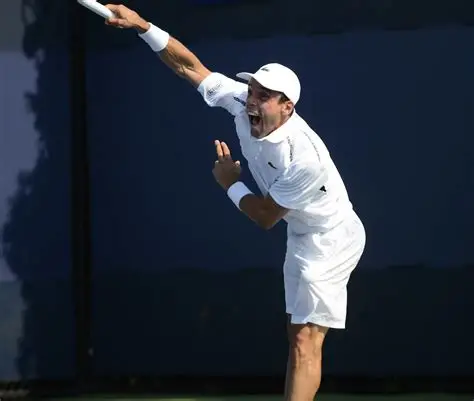 A tennis player serving