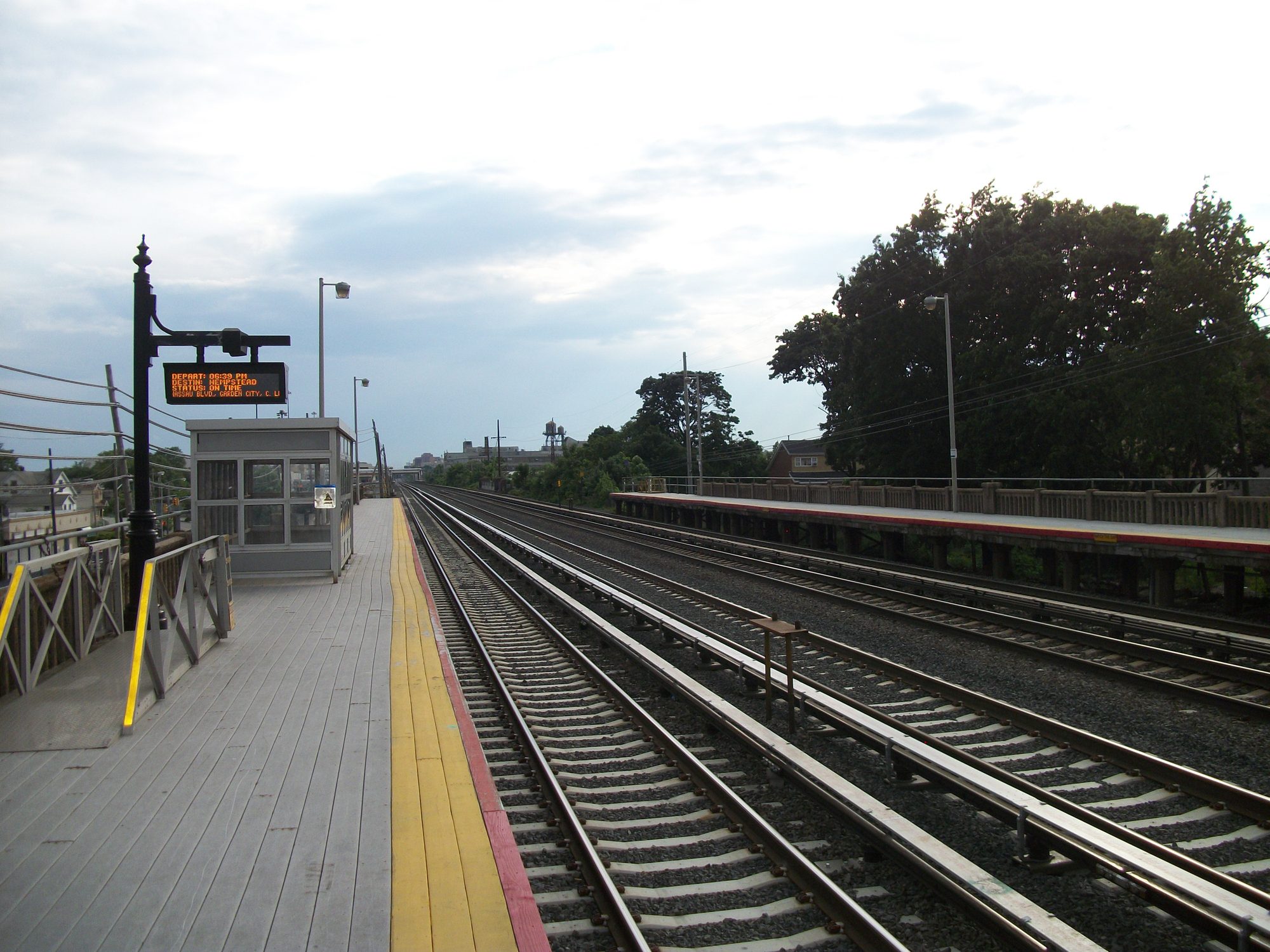 The Hollis Long Island Rail Road station looking west toward Jamaica in Hollis, Queens.