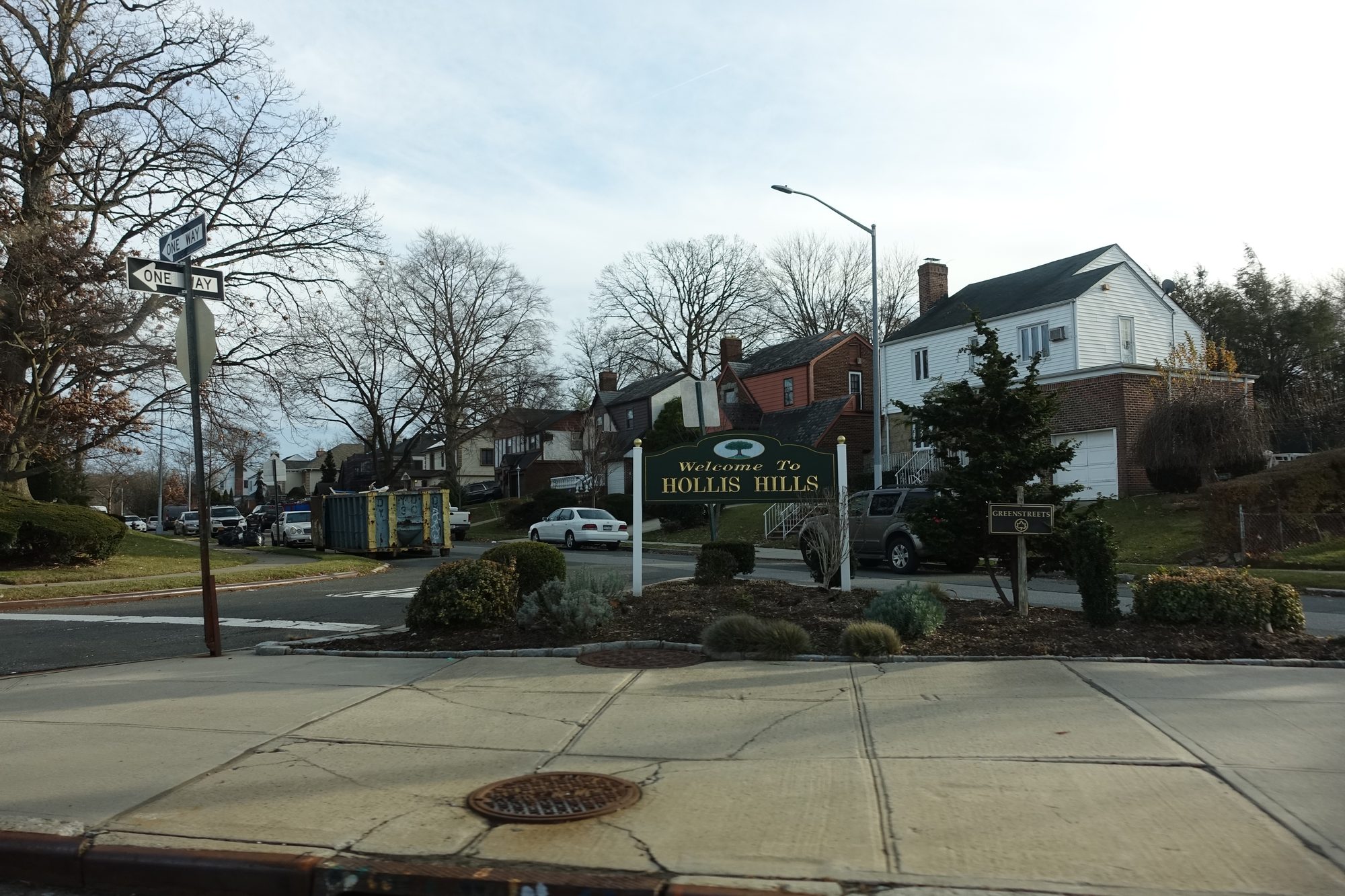 The Welcome to Hollis Hills sign on Union Turnpike at Peck Avenue in Hollis Hills, Queens.