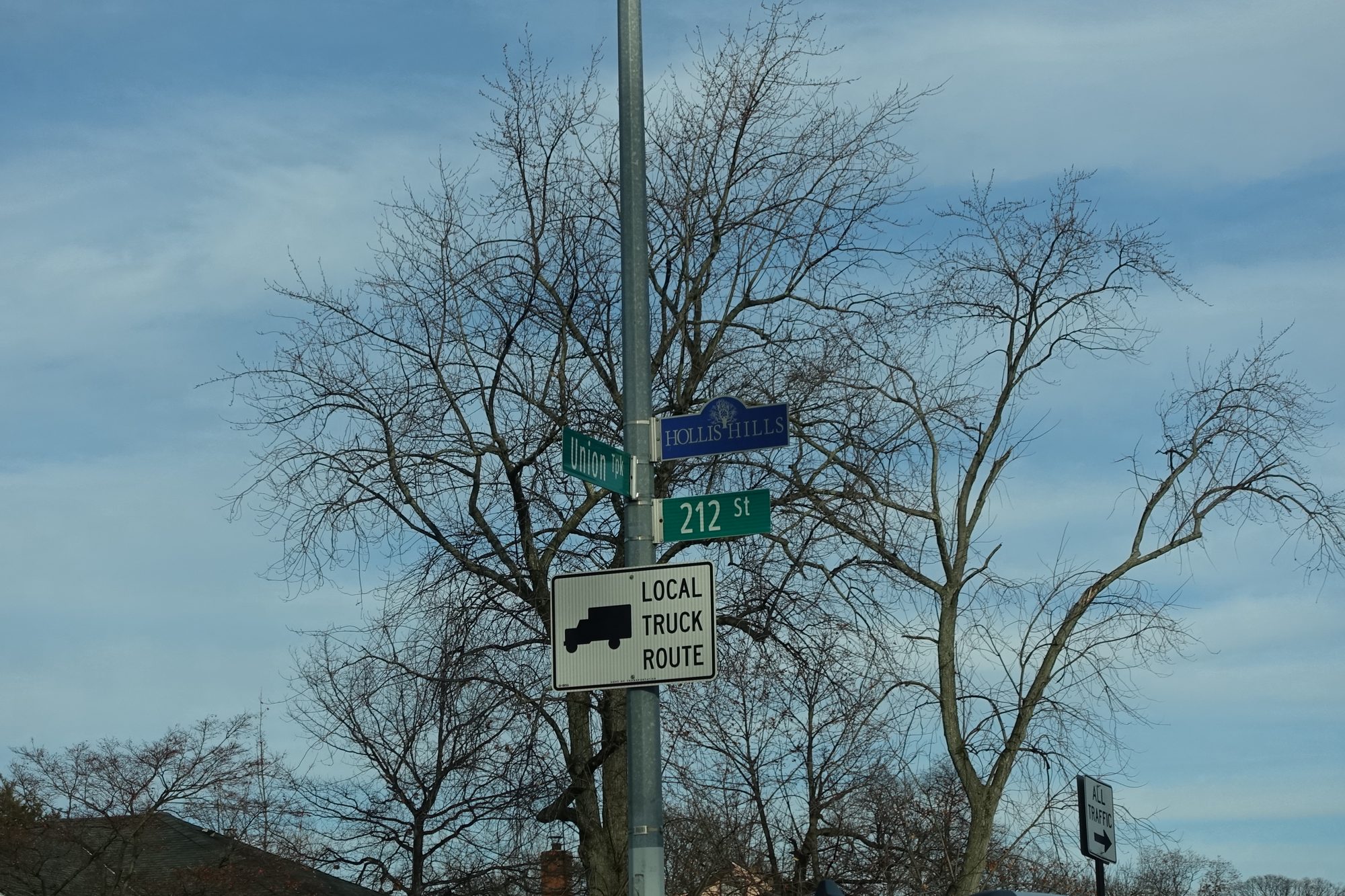 A Hollis Hills street sign in the median of Union Turnpike at 212th Street in Hollis Hills, Queens.