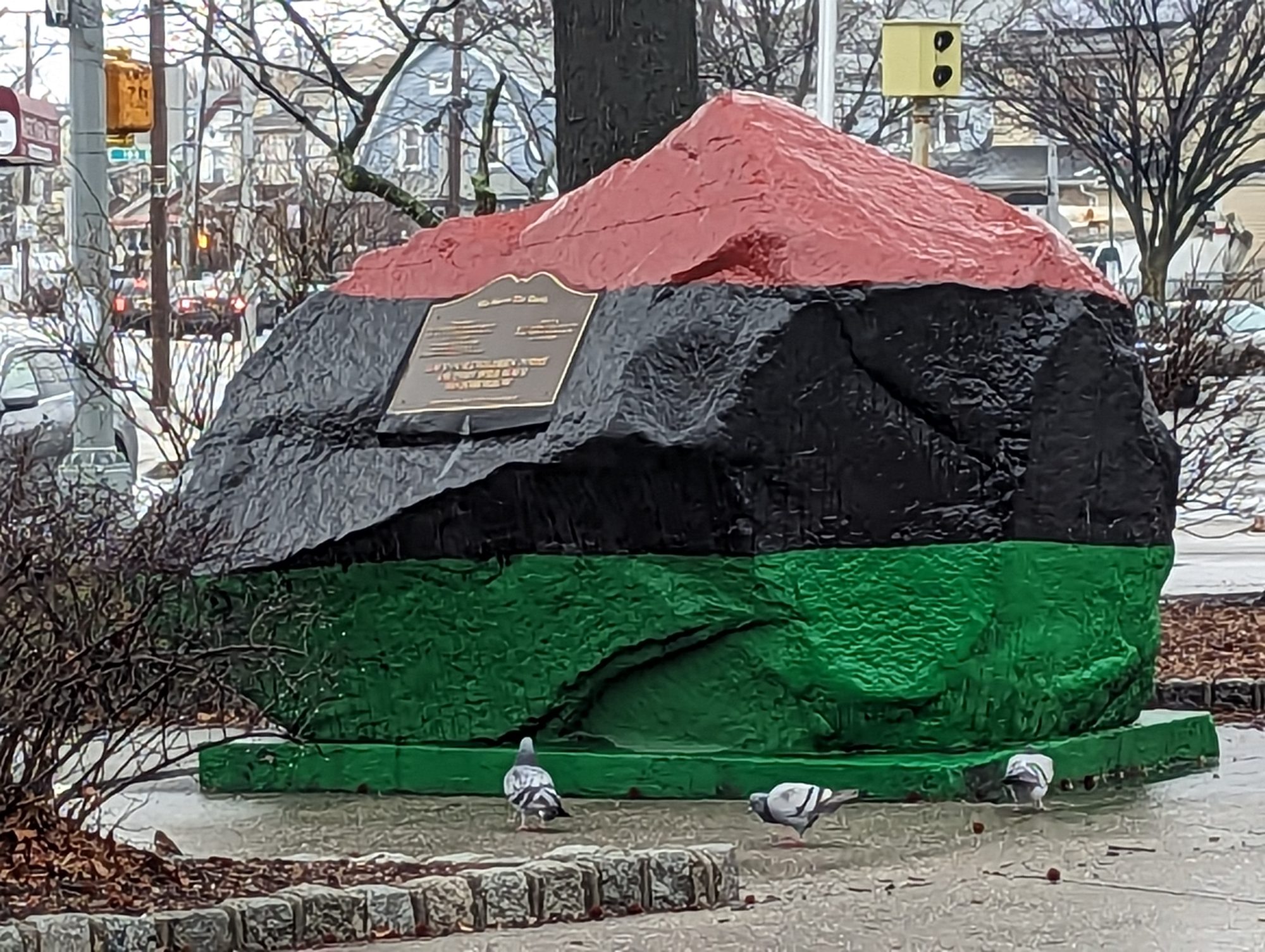 Liberty Rock, the boulder painted in Pan-African flag colors at Liberty Triangle where St. Albans, Hollis, and Jamaica meet in Queens.